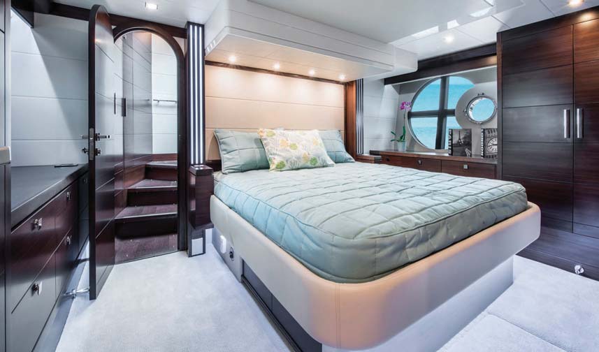 The master stateroom full beam layout is bright and open thanks to two large windows in either side of the hull.