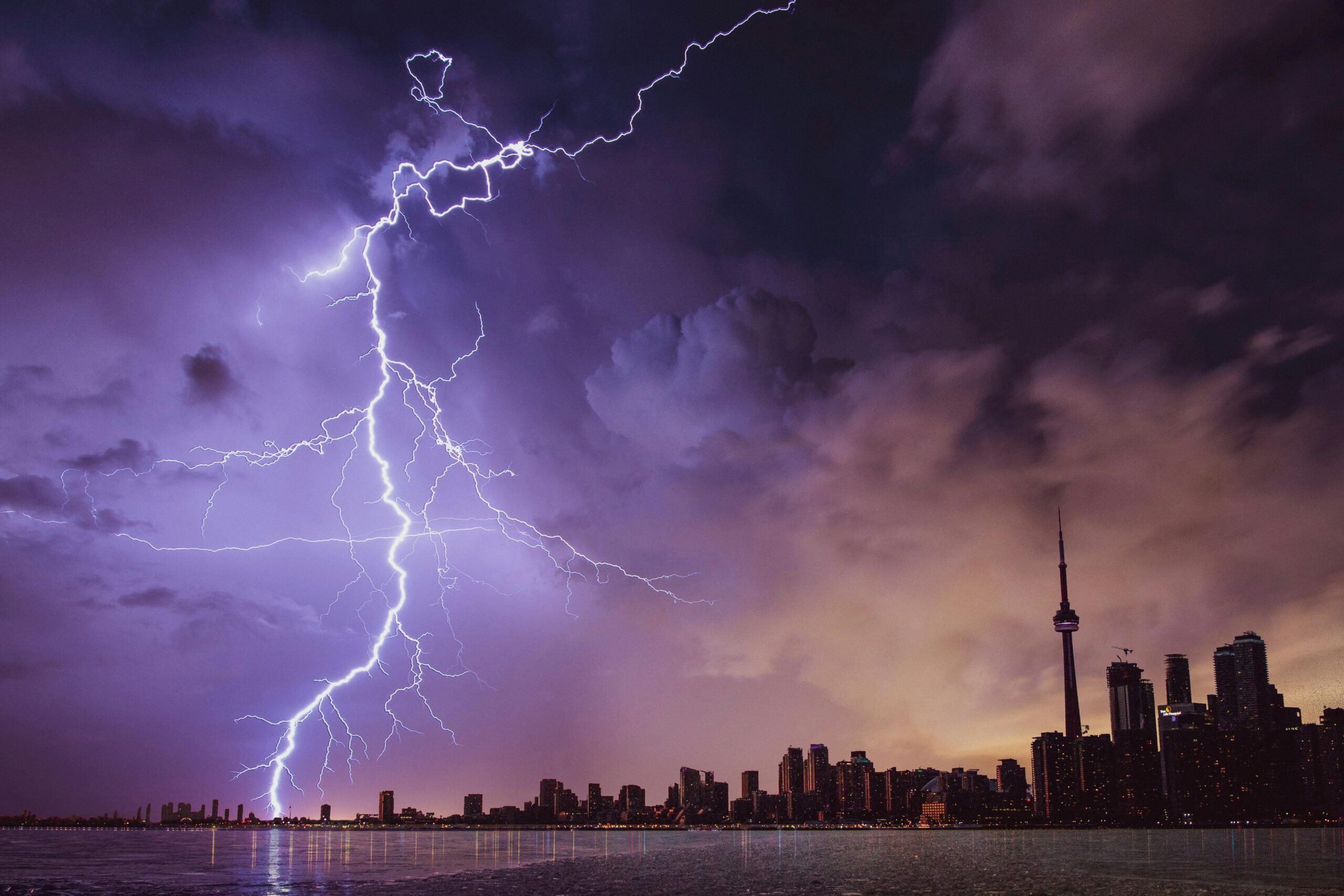 Lightning hitting lake Ontario during a thunderstorm in Toronto.