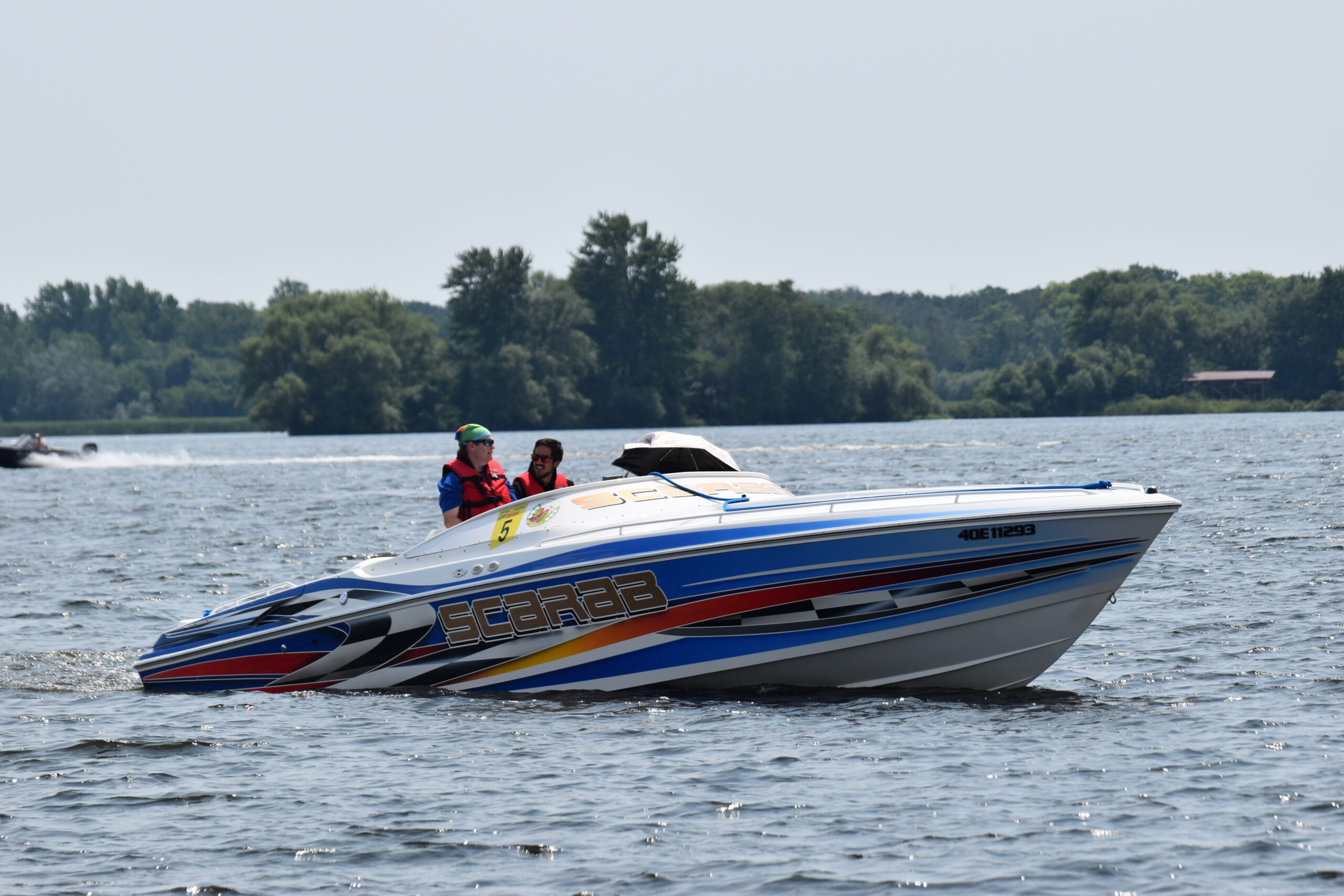 Mike Gurnsey and family in his 33' Scarab along with Mercury's Andres Ruiz Nunez.