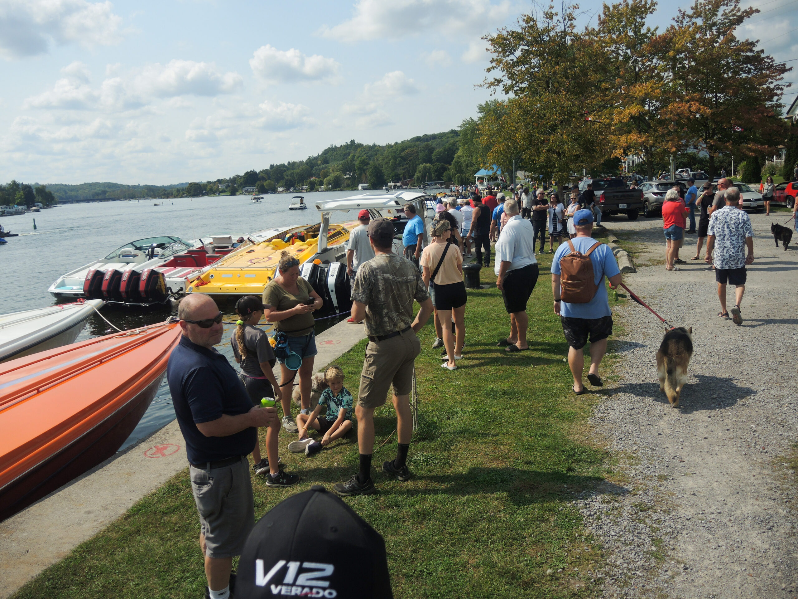 Poker Runners and spectators gather at the dock, admiring theimpressive lineup of exotic boats as they arrive for a lunch stop.