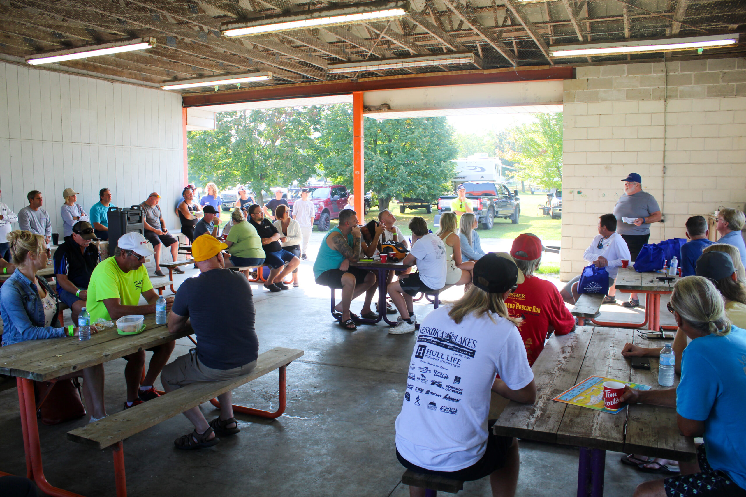 Gathered at the pavilion, Poker Runners attendthe drivers meeting, led by Carl as he prepares them for the excitement ahead.