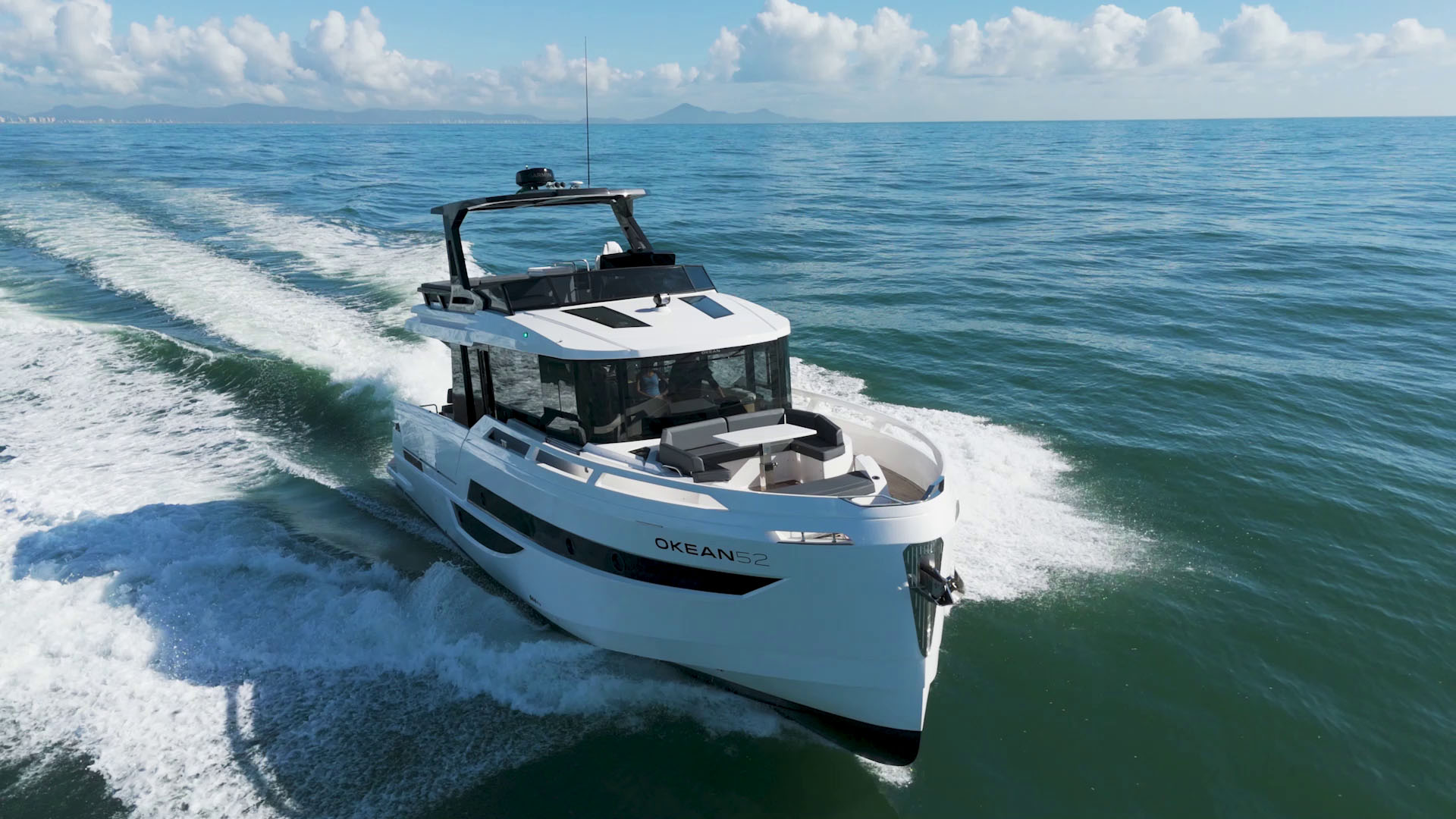 The open concept of the OKEAN 52 allows you to have performance and aesthetics in the same vessel. There are three comfortable cabins and a living space with 1.080 square feet of usable area that expands even more with the open decks. The Beach Club at the stern brings you the sea in comfort and safety.